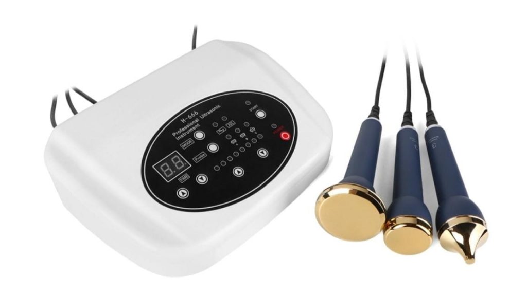 Equipo de ultrasonido estético con consola y manerales para tratamientos faciales y corporales.